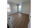 This bedroom offers great natural light, laminate flooring, and a pleasant view at 1248 Lady Bird Way, North Myrtle Beach, SC 29582
