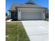 Charming single-story home featuring an attached two-car garage and a well-maintained lawn at 1248 Lady Bird Way, North Myrtle Beach, SC 29582