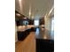 Modern kitchen featuring dark cabinetry, an island, stainless steel appliances, and a stylish backsplash at 1248 Lady Bird Way, North Myrtle Beach, SC 29582