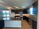 Well-lit kitchen boasting a large island, sleek appliances, and plenty of storage space at 1248 Lady Bird Way, North Myrtle Beach, SC 29582