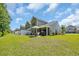Spacious backyard featuring a patio with outdoor seating and a well-maintained lawn at 132 Machrie Loop # A, Myrtle Beach, SC 29588