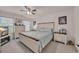 Cozy bedroom with a ceiling fan, a comfortable bed, two nightstands, and matching dressers at 132 Machrie Loop # A, Myrtle Beach, SC 29588