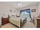 Guest bedroom featuring blue curtains and decor, a ceiling fan and two dressers at 132 Machrie Loop # A, Myrtle Beach, SC 29588