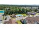 Aerial view of the community pool and clubhouse, surrounded by trees and residences at 132 Machrie Loop # A, Myrtle Beach, SC 29588