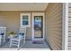 Inviting front porch with rocking chairs and a decorated glass front door at 132 Machrie Loop # A, Myrtle Beach, SC 29588