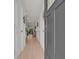 Bright hallway with hardwood floors and view into the living spaces at 132 Machrie Loop # A, Myrtle Beach, SC 29588
