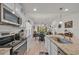 Bright kitchen showcasing granite countertops, stainless steel appliances, and eat-in dining space at 132 Machrie Loop # A, Myrtle Beach, SC 29588