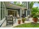 Outdoor seating arrangement featuring a grill with a sliding glass door to the house at 1325 Clipper Dr., North Myrtle Beach, SC 29582