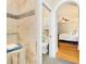 Spacious shower features tiled walls and a mosaic accent wall, with adjacent commode and bedroom views at 1325 Clipper Dr., North Myrtle Beach, SC 29582