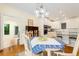 Dining area with table, chairs, and chandelier, flowing into a bright kitchen with ample counter space at 1325 Clipper Dr., North Myrtle Beach, SC 29582