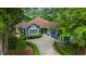 Charming blue home featuring a well manicured front yard and a winding driveway at 1325 Clipper Dr., North Myrtle Beach, SC 29582