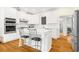 Updated kitchen with white cabinets, stainless steel appliances, and an island with bar seating at 1325 Clipper Dr., North Myrtle Beach, SC 29582