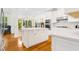 Modern kitchen with white cabinets, stainless appliances, center island and an open layout for easy entertaining at 1325 Clipper Dr., North Myrtle Beach, SC 29582