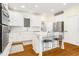 Modern kitchen featuring white cabinets, stainless steel appliances, and an island with barstools at 1325 Clipper Dr., North Myrtle Beach, SC 29582