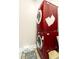 This laundry room features a modern, stacked, red washer and dryer set and an area rug at 1325 Clipper Dr., North Myrtle Beach, SC 29582