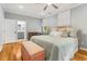 This main bedroom features a connecting door to the ensuite bathroom, plus hardwood floors and natural light at 1325 Clipper Dr., North Myrtle Beach, SC 29582