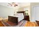 Comfortable main bedroom features a ceiling fan, windows for natural light, and calming color palette at 1325 Clipper Dr., North Myrtle Beach, SC 29582