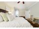 This main bedroom has a comfortable bed, soft lighting, and doorway to the ensuite at 1325 Clipper Dr., North Myrtle Beach, SC 29582