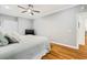 An airy main bedroom, providing comfort and privacy, features hardwood floors and a neutral color palette at 1325 Clipper Dr., North Myrtle Beach, SC 29582