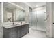 Modern bathroom with double sink vanity, large mirror, and glass enclosed shower at 139 Pioneer Loop, Georgetown, SC 29440