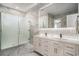 Elegant bathroom features double sinks, a glass-enclosed shower, and marble countertops at 139 Pioneer Loop, Georgetown, SC 29440