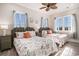 Charming bedroom with two beds, bedside tables and decorative artwork, bathed in natural light at 139 Pioneer Loop, Georgetown, SC 29440