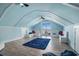 Bright bonus room with built-in benches, a blue rug, and a sliding door to the outside at 139 Pioneer Loop, Georgetown, SC 29440