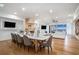 Open-concept living and dining area with ocean view, fireplace and hardwood flooring at 139 Pioneer Loop, Georgetown, SC 29440