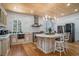 Gourmet kitchen with stainless steel appliances, an island and marble backsplash at 139 Pioneer Loop, Georgetown, SC 29440