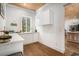 Bright kitchenette area with modern white cabinets and hardwood floors at 139 Pioneer Loop, Georgetown, SC 29440