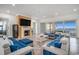 Open-concept living room with fireplace, ocean views, comfortable seating, and natural light at 139 Pioneer Loop, Georgetown, SC 29440