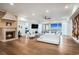 Bright open-concept living area with a fireplace, hardwood floors, and ocean views at 139 Pioneer Loop, Georgetown, SC 29440