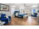 Large main bedroom with water views, balcony access, hardwood floors and blue accents at 139 Pioneer Loop, Georgetown, SC 29440