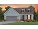 Charming single-Gathering home with a two-car garage, dormer windows, and welcoming front porch at 1423 Winding Creek Way, Myrtle Beach, SC 29588