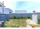Enclosed backyard with a patio, storage shed, and mature landscaping at 1437 Baldwin Ct. # 1437, Little River, SC 29566