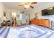 Bright bedroom with ceiling fan, TV, and cozy decor at 1437 Baldwin Ct. # 1437, Little River, SC 29566