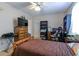Spacious bedroom with carpet, ceiling fan, and a large flat-screen TV at 1437 Baldwin Ct. # 1437, Little River, SC 29566