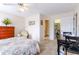 Comfortable bedroom with a ceiling fan, carpet, and a view of the closet and hall at 1437 Baldwin Ct. # 1437, Little River, SC 29566