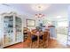 Cozy dining area features a wooden table set, beautiful cabinet, and adjoins a well-lit kitchen at 1437 Baldwin Ct. # 1437, Little River, SC 29566