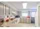 Bright kitchen with classic cabinets, white appliances, and practical layout at 1437 Baldwin Ct. # 1437, Little River, SC 29566