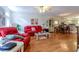 Cozy living room with hardwood floors, bright light, and adjacent dining area at 1437 Baldwin Ct. # 1437, Little River, SC 29566