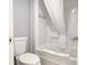 Bright bathroom featuring a shower-tub combo, toilet and tiled surround at 1501 S Ocean Blvd. # 239, Myrtle Beach, SC 29577
