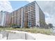 Beachfront condo building view from sandy beach with dunes and ocean view at 1501 S Ocean Blvd. # 239, Myrtle Beach, SC 29577