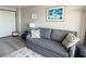 Cozy living room with a grey sofa, decorative pillows, and beach-themed artwork at 1501 S Ocean Blvd. # 239, Myrtle Beach, SC 29577