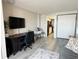 Open living space with a desk, television, and view into the kitchen at 1501 S Ocean Blvd. # 239, Myrtle Beach, SC 29577