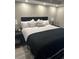 Simple main bedroom with a king-sized bed, neutral color scheme, and bedside lamps at 1501 S Ocean Blvd. # 239, Myrtle Beach, SC 29577