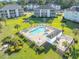 Aerial view showcasing community pool, landscaping, and multiple buildings on the golf course at 1505 Lantern Rest Dr. # 301, Myrtle Beach, SC 29579