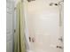 Bright bathroom featuring a shower/tub combo with white tile surround and neutral walls at 1505 Lantern Rest Dr. # 301, Myrtle Beach, SC 29579