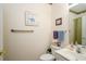 Accessible half bathroom featuring a toilet, sink, mirror, and grab bar for added safety and convenience at 1505 Lantern Rest Dr. # 301, Myrtle Beach, SC 29579