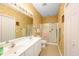 Well-lit bathroom with a double vanity, large mirror, and a glass-enclosed shower at 1505 Lantern Rest Dr. # 301, Myrtle Beach, SC 29579